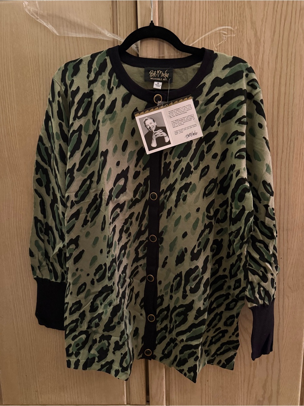 Bob Mackie Green and Black Animal Print sweater top. Buttons for decoration
